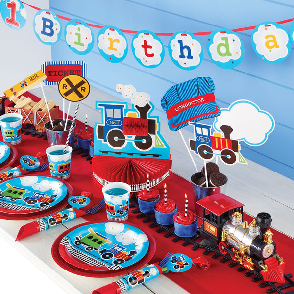 All Aboard 1st Birthday Party Supplies displayed on a table