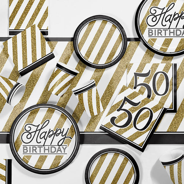 Black and Gold 50th Birthday Party Supplies on a table