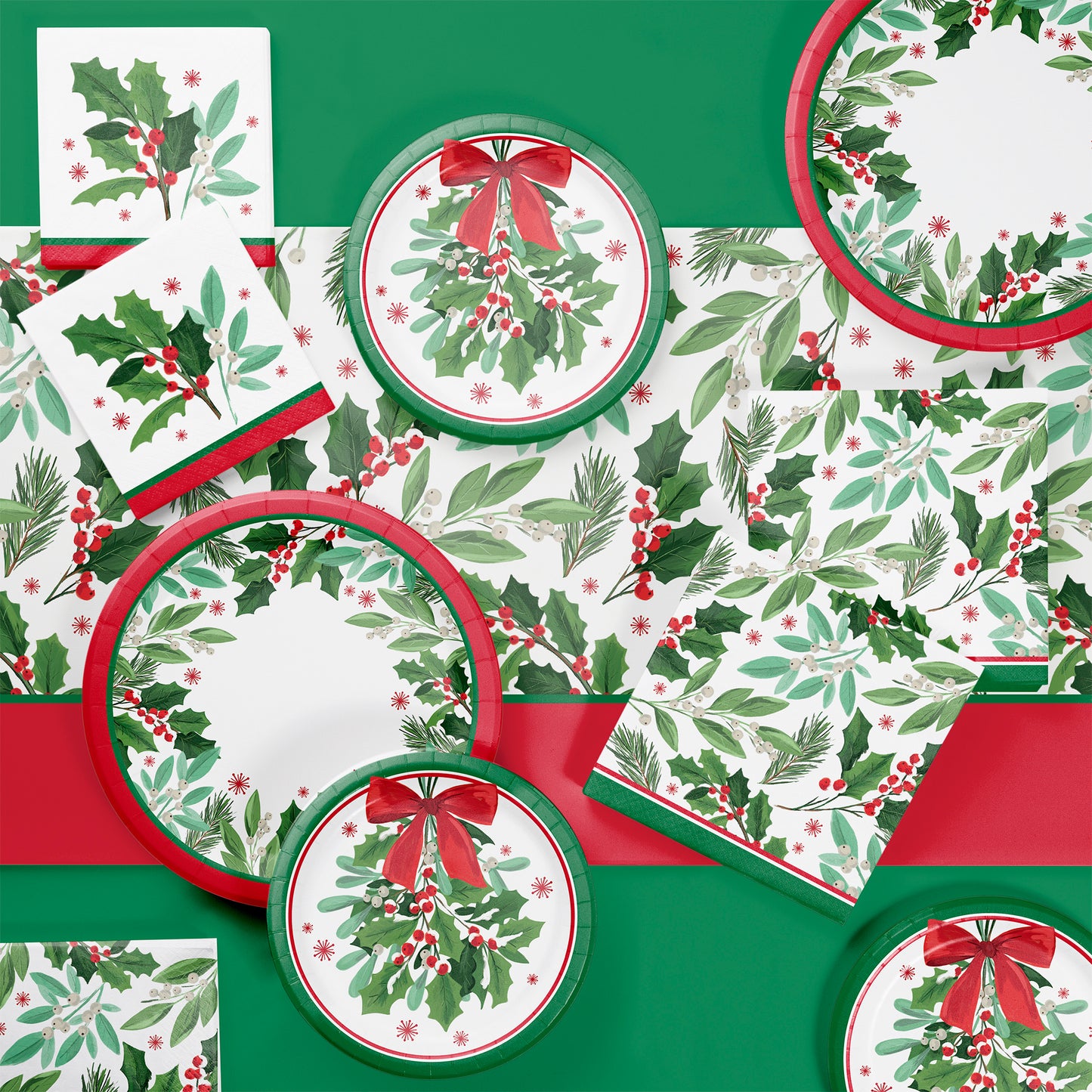 Christmas-themed tableware with holly design on a green background
