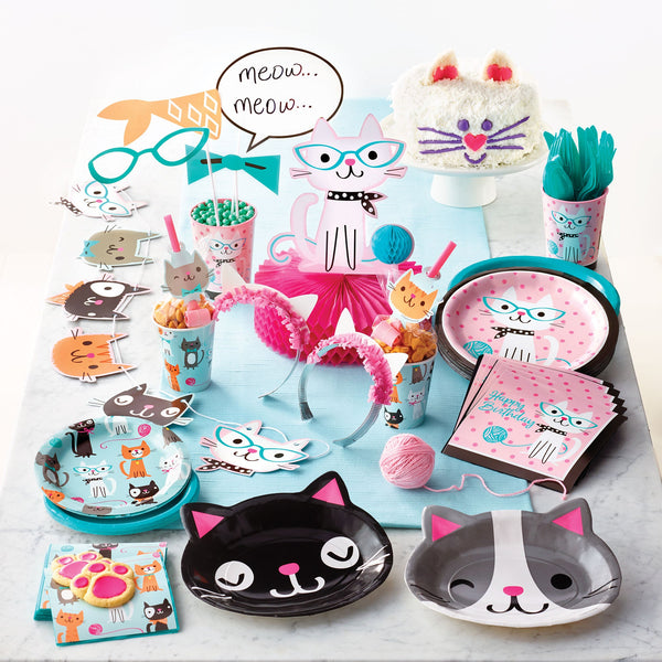 Cat Party Supplies. Cat plates, napkins and decorations displayed on a blue tablecloth