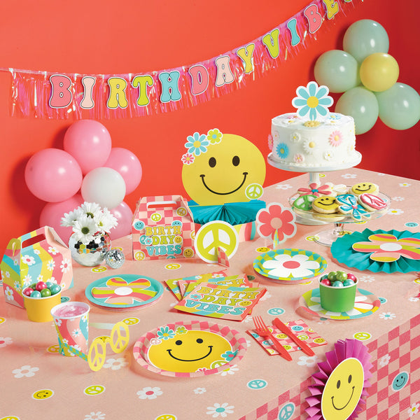 Flower Power Party Supplies displayed on a table