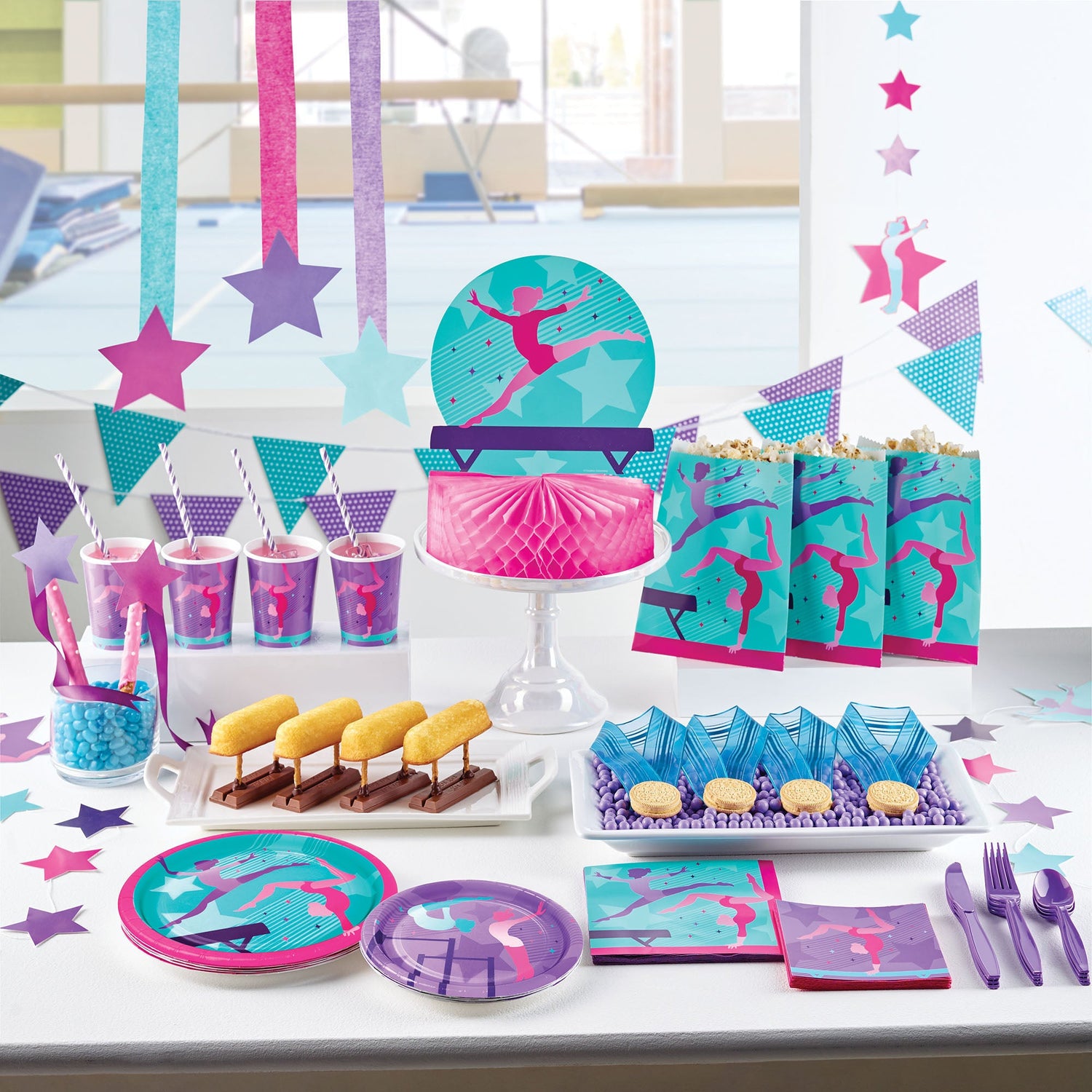 Gymnastics Party Party Supplies displayed on a table