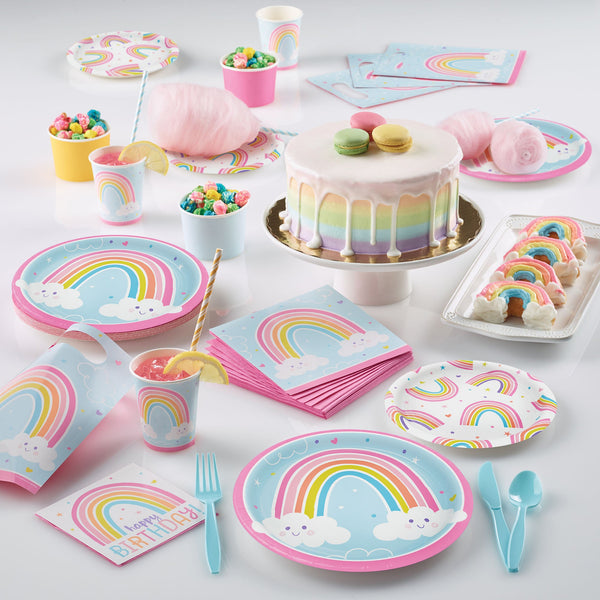 Happy Rainbow Party Supplies displayed on a table