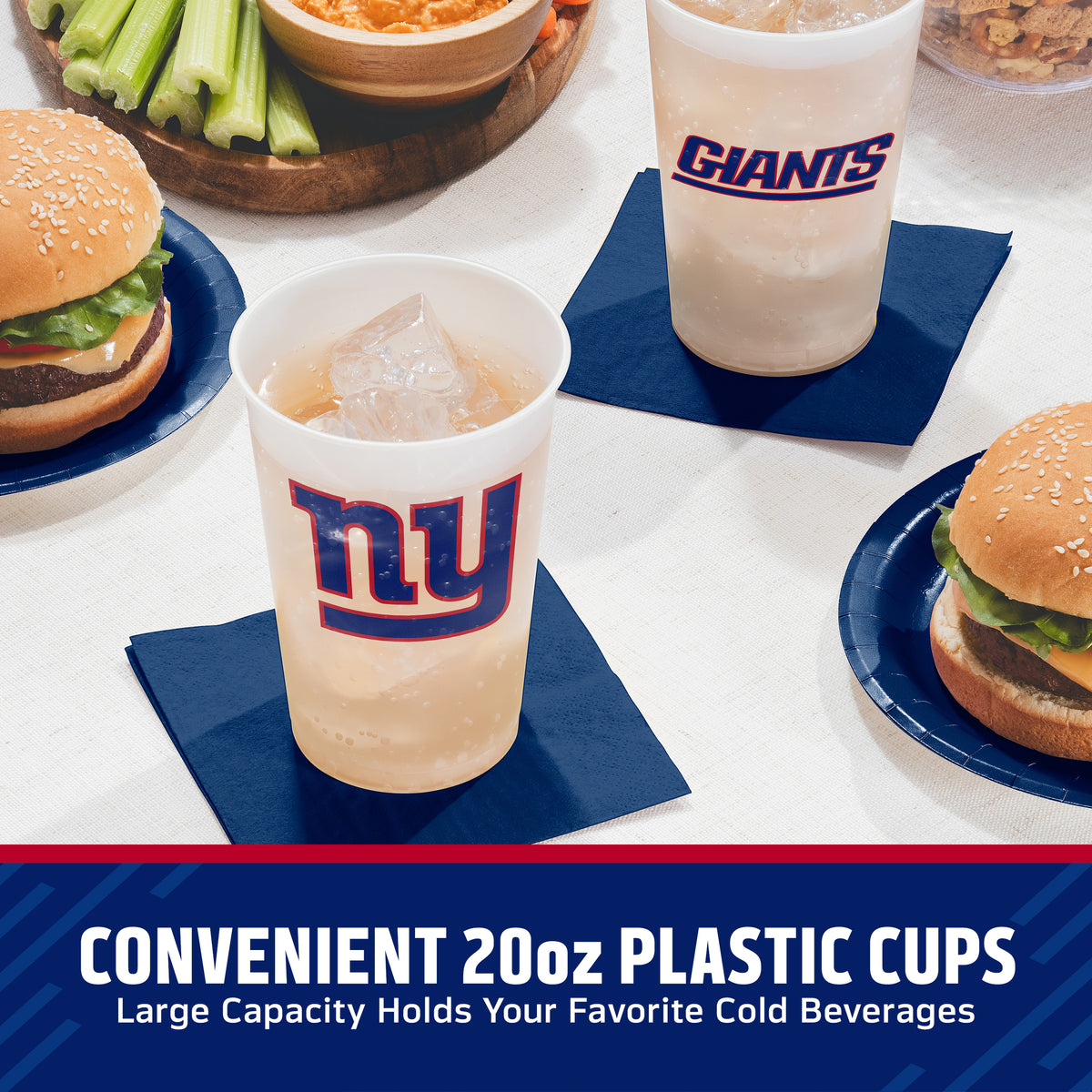 Two New York Giants branded 20oz plastic cups on blue napkins, shown with burgers, celery, and a drink on a tabletop. Text at the bottom reads 'CONVENIENT 20oz PLASTIC CUPS Large Capacity Holds Your Favorite Cold Beverages.