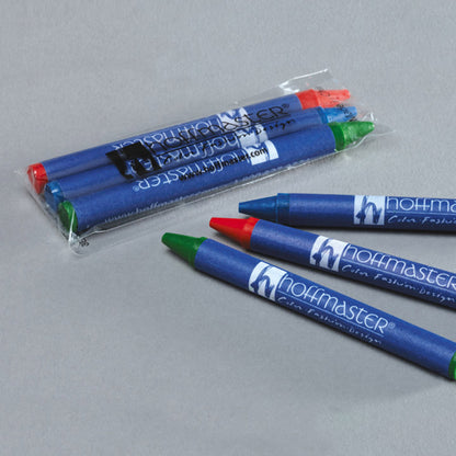 Packaged Hoffmaster colored crayons on a gray background
