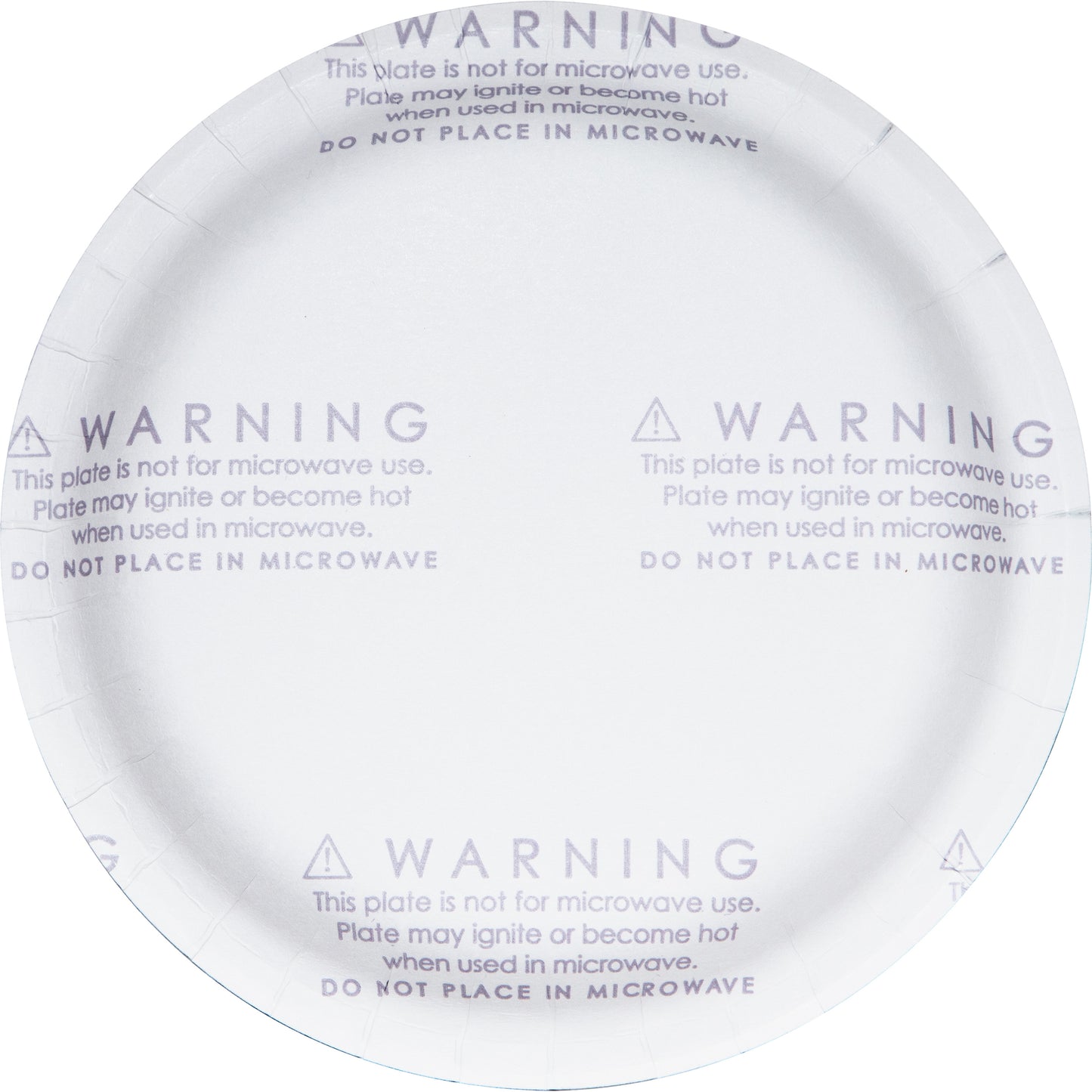 Dinner plate with warning label on the back saying "This plate is not for microwave use"