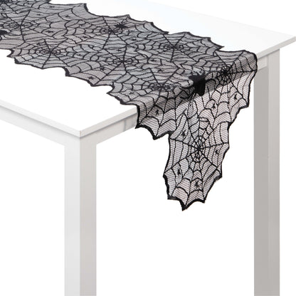 Black Lace Webs Table Runners 12 ct. Black lace spider web table runner on a white table