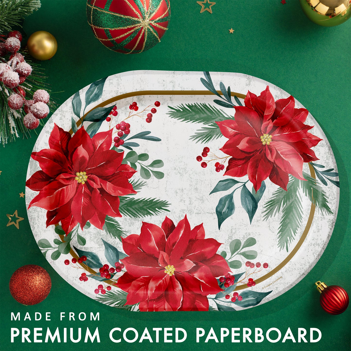 Oval paper plate with red floral design on a green background with Christmas ornaments.