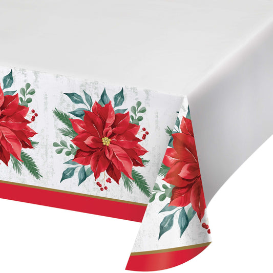 Festive Floral Paper Tablecloths 12 ct. Christmas-themed paper tablecloth with red poinsettias and green leaves on a white background