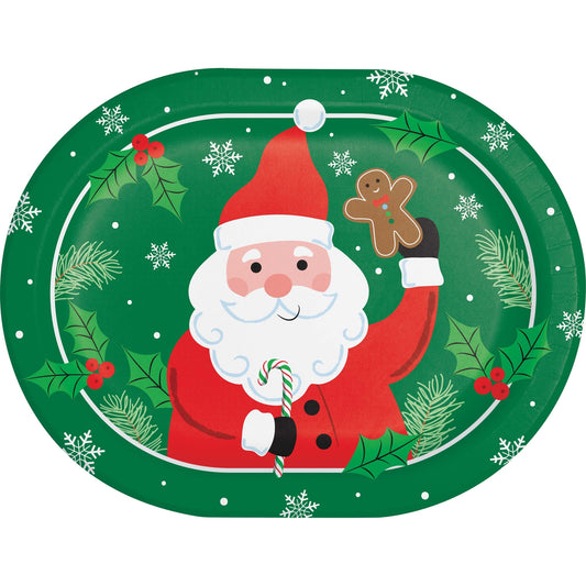 Christmas-themed plate with Santa Claus holding a candy cane and gingerbread man, surrounded by holly leaves and snowflakes on a green background.