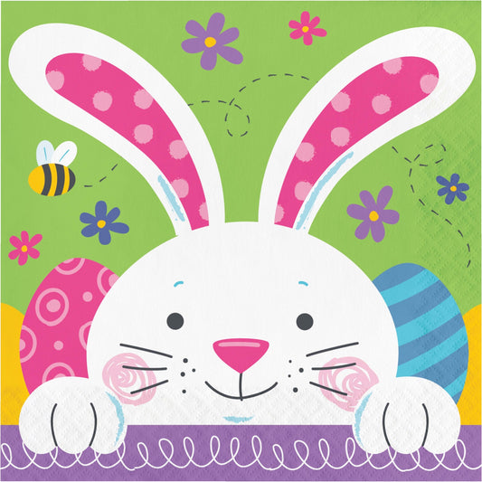 Colorful Easter-themed napkins with a bunny design on a green background.