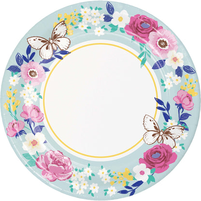 Decorative plate with floral design and butterflies on a light blue background