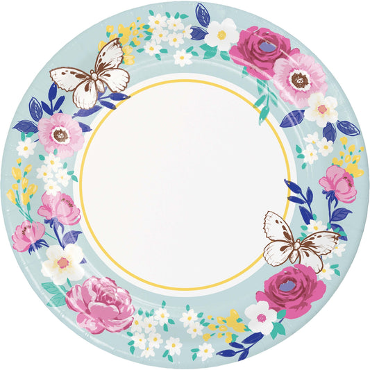 Decorative plate with floral design and butterflies on a light blue background