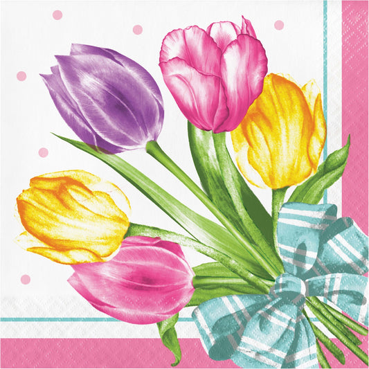 Napkin with colorful tulips and a bow on a pink background