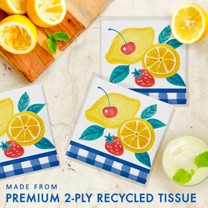 Set of decorative paper napkins with lemon, strawberry and cherry design on a light background.