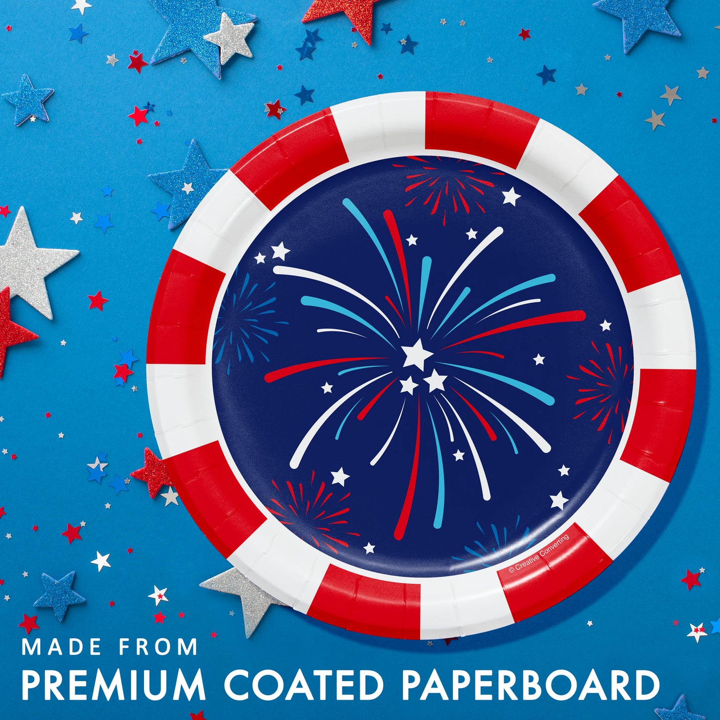 Red, white, and blue paper plate with fireworks design on a blue background with stars.