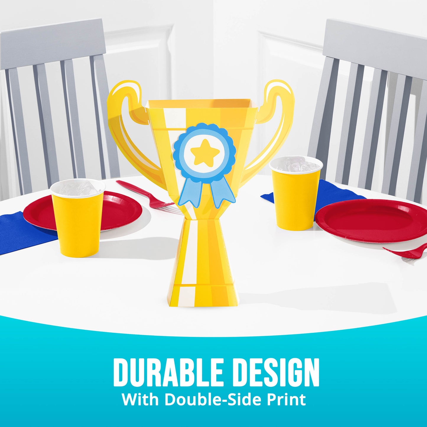 Yellow trophy centerpiece with a blue ribbon on a table setting with red and white plates, and yellow cups.