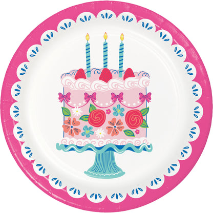 Decorative paper plate with a birthday cake design featuring candles, flowers, and a pink border.
