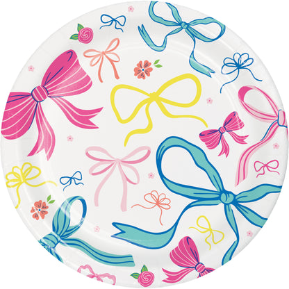 Round paper plate with colorful bow and flower pattern on a white background