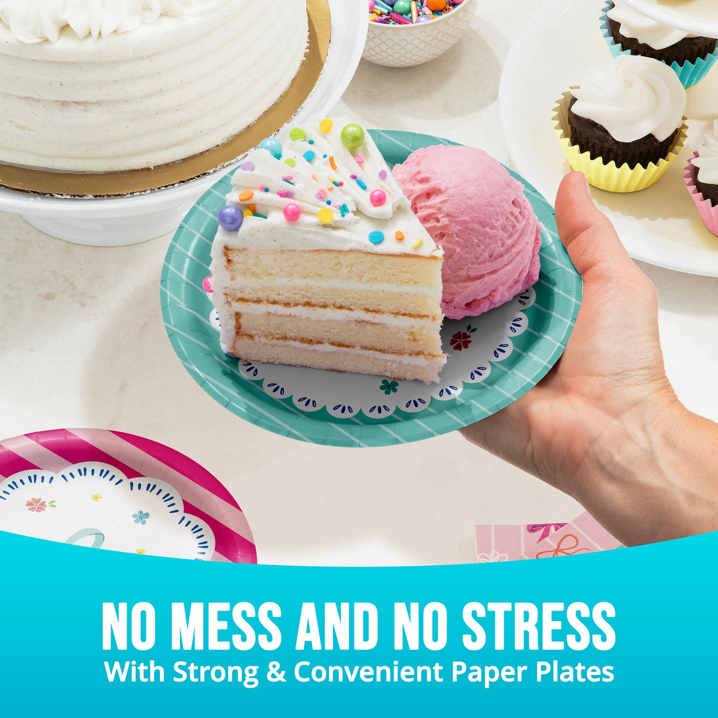 Hand holding a slice of cake on a paper plate with ice cream, surrounded by other desserts.