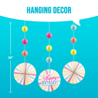 Colorful hanging birthday decor with paper balls and fans on a blue background with dimensions shown