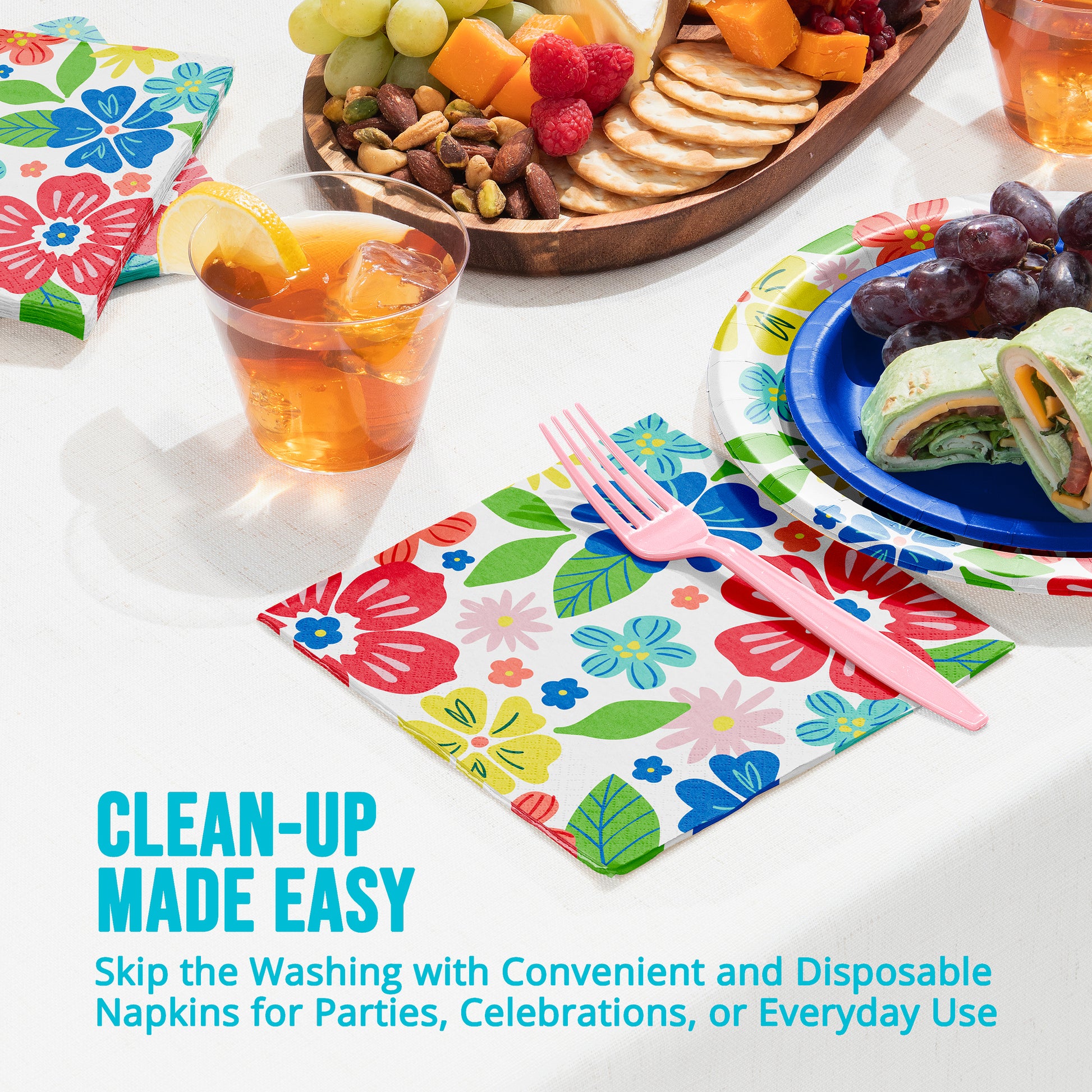 Colorful disposable napkins with cutlery on a table setting with food.