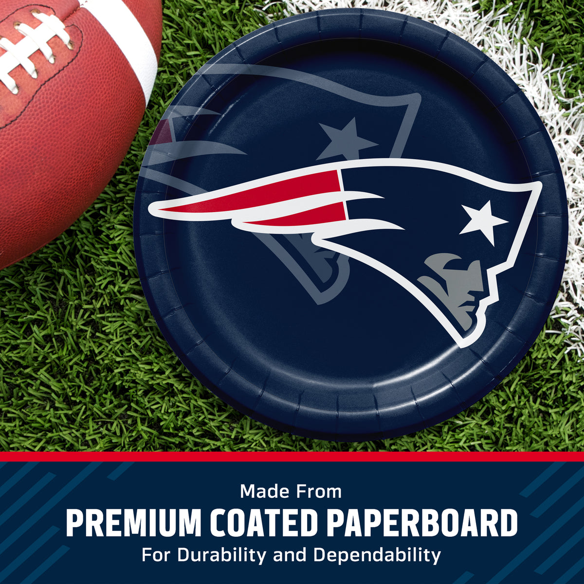 A round navy blue paper plate featuring the New England Patriots logo, shown on a grassy football field with part of a football visible at the left edge. A dark blue banner at the bottom reads 'Made From PREMIUM COATED PAPERBOARD For Durability and Dependability'.