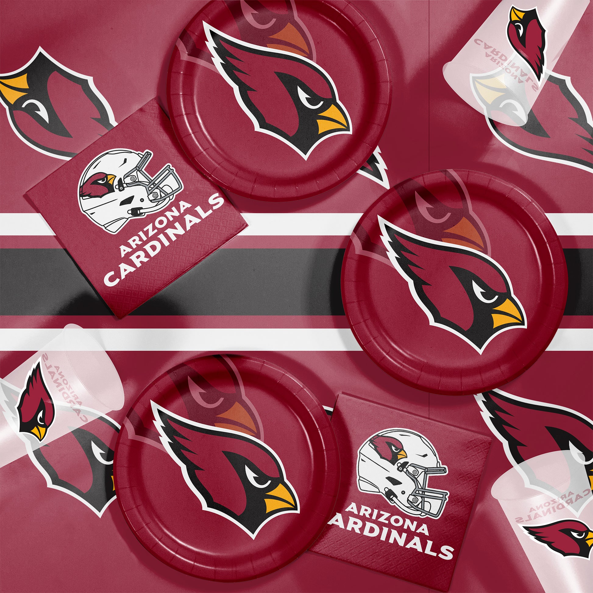 Arizona Cardinals-themed party supplies including plates and napkins on a black background.