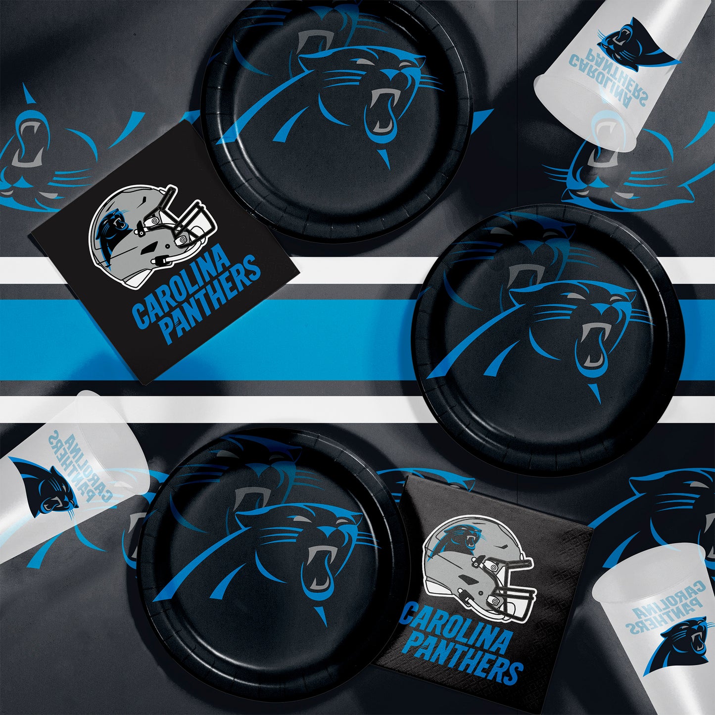 Carolina Panthers party supplies including plates, cups, and napkins on a black and blue striped background.