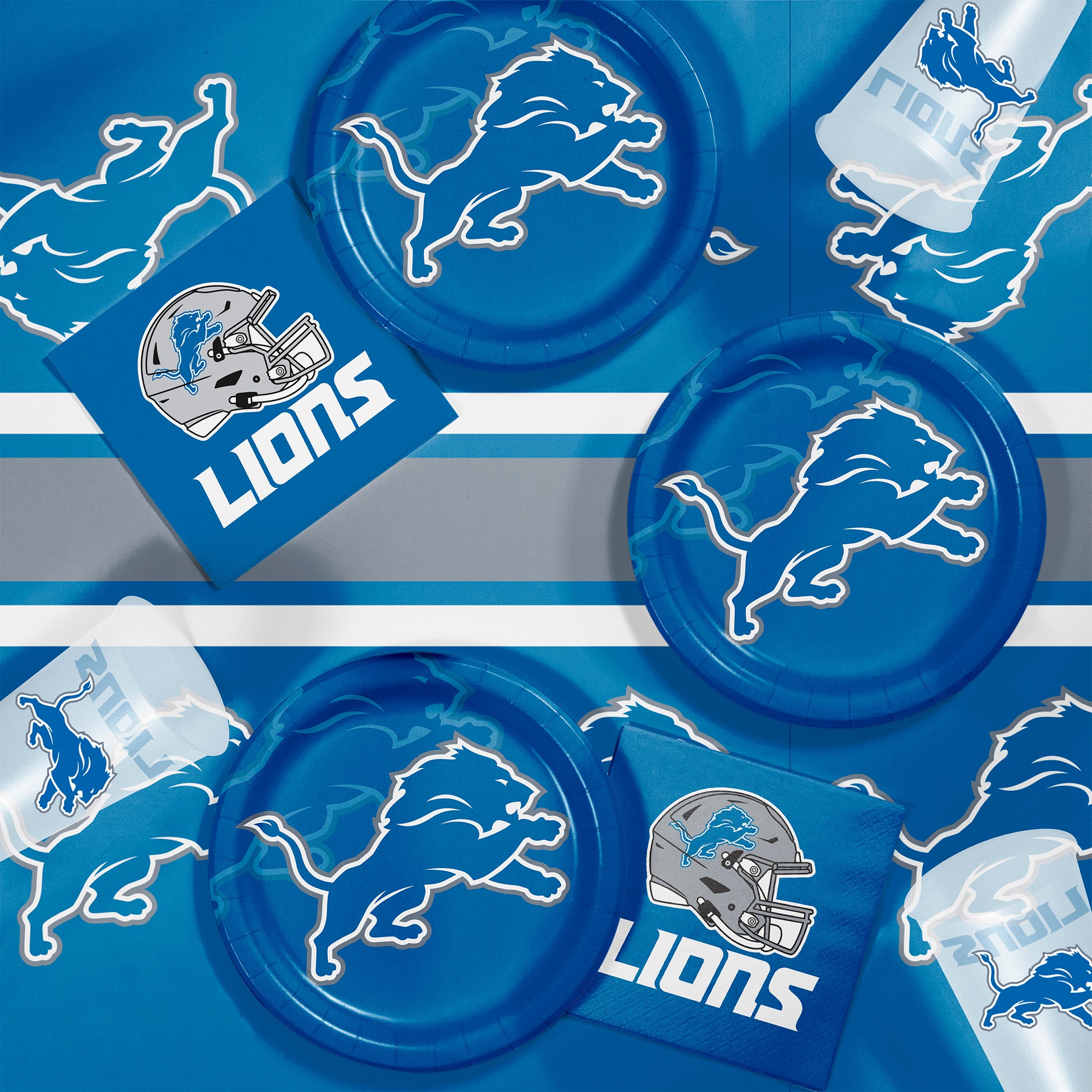 Detroit Lions plates, napkins and cups displayed on a matching tablecloth