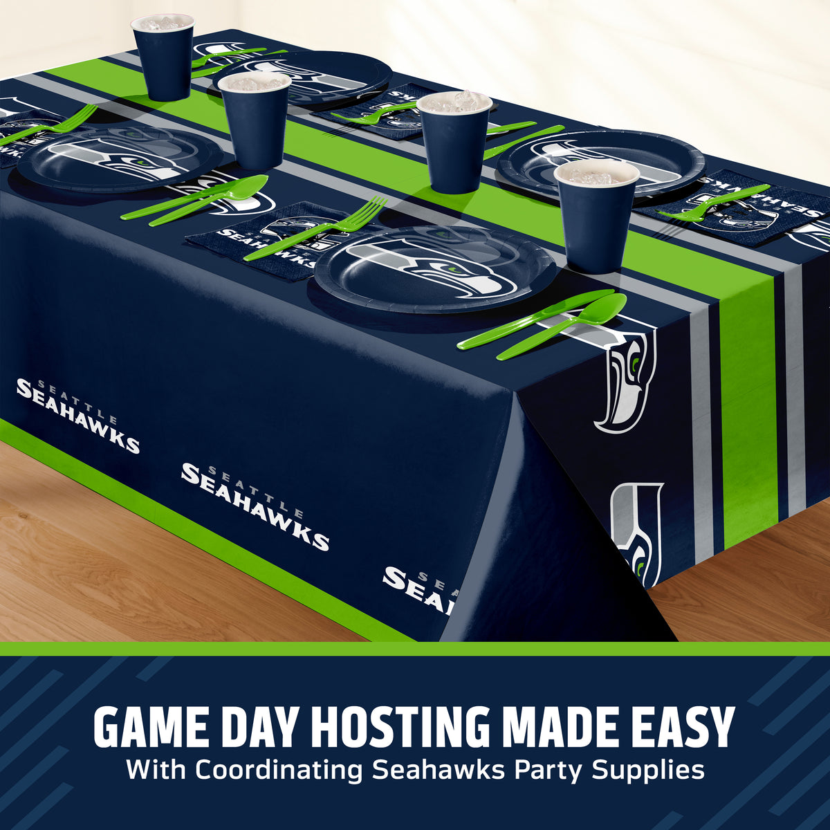 Seattle Seahawks themed party table setting with a printed tablecloth, matching plates, cups, and utensils, shown on a table with a promotional banner at the bottom that says "Game Day Hosting Made Easy".