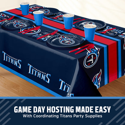 Tennessee Titans themed party table setting with a printed tablecloth, matching plates, cups, and utensils, shown on a table with a promotional banner at the bottom that says "Game Day Hosting Made Easy".